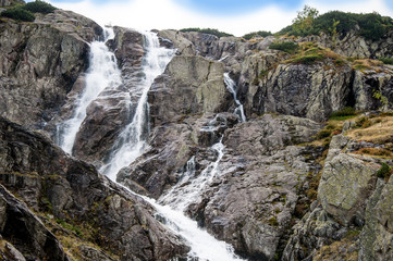 Fototapeta na wymiar mountain waterfall / Mountain view with the huge waterfall 