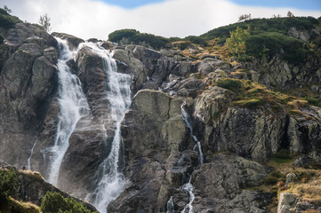 Fototapeta na wymiar mountain waterfall / Mountain view with the huge waterfall 