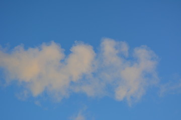 white vapor (smoke) on the background of blue sky, nature, landscape