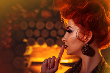 Fototapeta premium Model Girl in Autumn style at wooden fireplace background. Fashion Portrait. Creative make-up and hairstyle