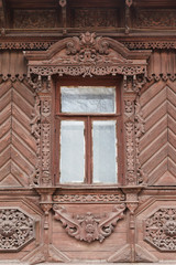 Carved window of old wooden house