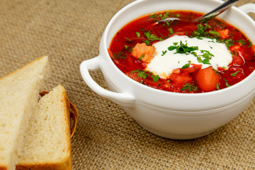 Traditional Ukrainian borsch with sour cream