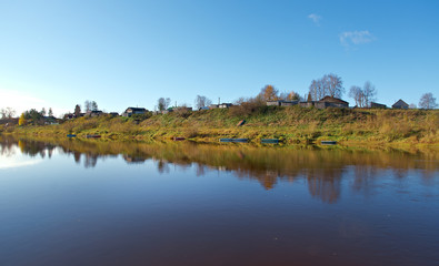 Fall River, reflected in the water autumn trees.