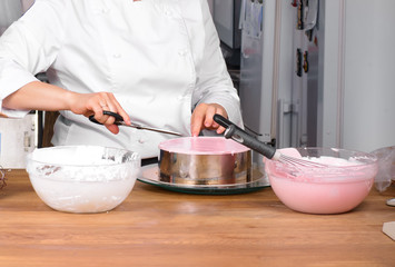 fruit cake preparing on kitchen table with kitchenware