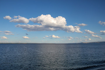 River landscape, clouds over the river