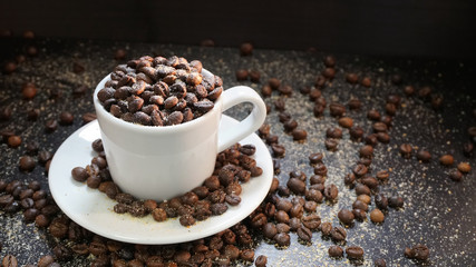 White Cup With Coffee Beans on Black Background