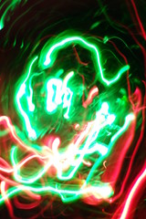 Chaotic lights in moriol blur out of focus - abstract photograph background.