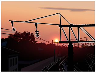 Sunset. City. Railway station. Silhouette of metallic constructions.
