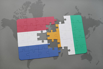 puzzle with the national flag of netherlands and cote divoire on a world map background.