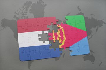 puzzle with the national flag of netherlands and eritrea on a world map background.