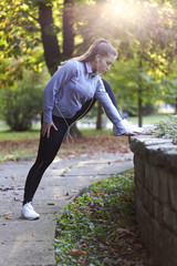 Young women stretching before running