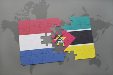 puzzle with the national flag of netherlands and mozambique on a world map background.