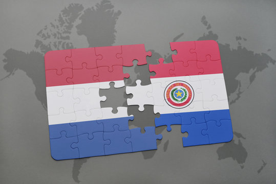 puzzle with the national flag of netherlands and paraguay on a world map background.