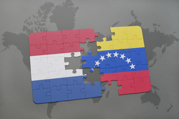 puzzle with the national flag of netherlands and venezuela on a world map background.