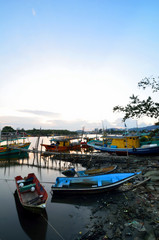 Obraz premium Boat at Jetty when sun goes down