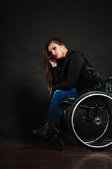 Naklejka na ściany i meble Sad girl on wheelchair.