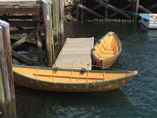 Obraz premium Two Wooden Rowboats at a Dock, Nova Scotia