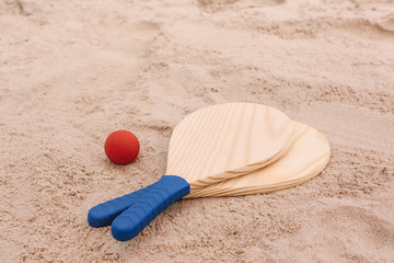 Fototapeta na wymiar Beach tennis, beach paddle ball, matkot. Beach rackets and ball on the beach sand