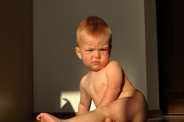 Nude little boy under the sun the morning 
