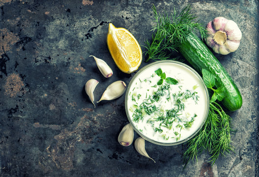 Tzatziki sauce ingredients Food background vintage toned