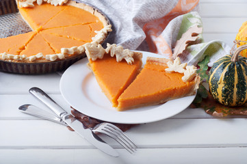 Three different kinds of decorative small pumpkins