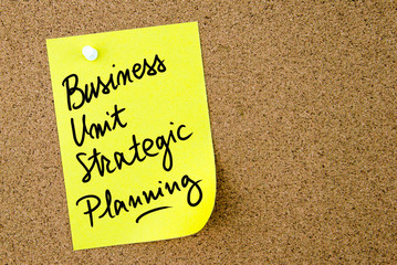 Business Unit Strategic Planning text written on yellow paper note