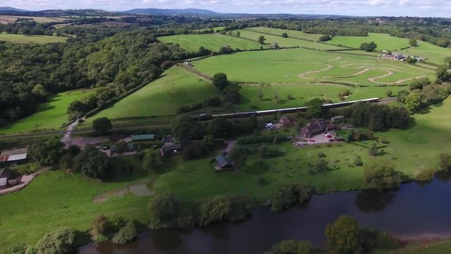 Aerial view of a train in the countryside.