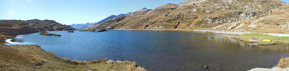 San Bernardino mountain pass, Switzerland. Fantastic view at Moesola alpine lake with blue sky.           