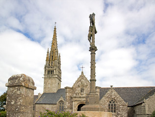 Fototapeta na wymiar Eglise de Beuzec, Christ en croix. Un jour de temps nuageux (Finistère, Bretagne, France)