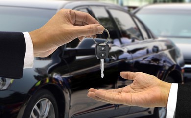 Fototapeta premium Car key hand over to the new owner