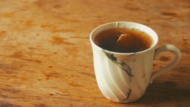 Cup with Tea on a Wooden Table