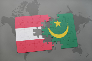 puzzle with the national flag of austria and mauritania on a world map background.