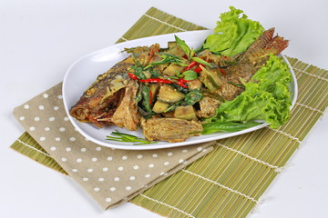 Green tilapia fish curry in coconut milk is popular Thai cuisine .
