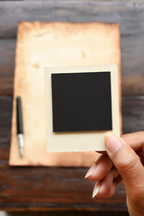 Old paper and pen with photo frame for background