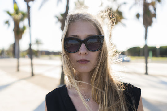 Attractive blond woman portrait at sunset