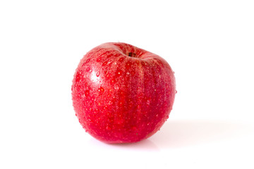 Red apple with drops  on white
