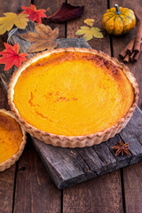 Thanksgiving pumpkin pie on a wooden table