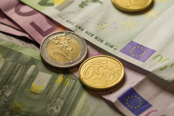 Euro coins and banknotes money. Macro background.
