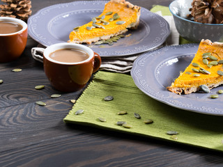Pieces of pumpkin pie with coffee