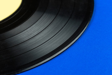 Retro vinyl record on blue background