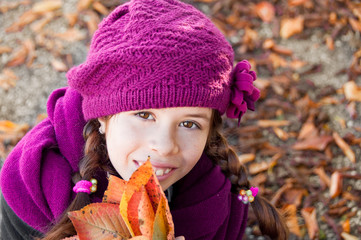 Portrait of a girl with autumn leaves
