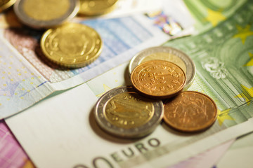 Euro coins and banknotes money. Macro background.
