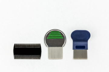 Three different kinds of lice combs. Studio shot on white background with copy space. 
