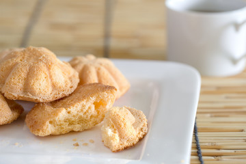 Egg cake, delicious dessert and black coffee in white dish