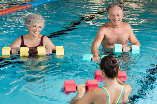 Seniors doing aqua aerobics
