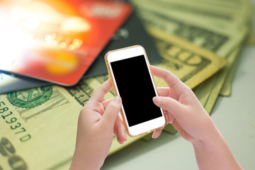 Mockup copyspace hands holding mobile phone with financial concept background