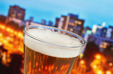 glass of beer in the night city