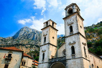 Fototapeta na wymiar Cathedral Saint Tryphon is Roman Catholic cathedral in old town of Kotor, Montenegro. Lovcen mountain at background.