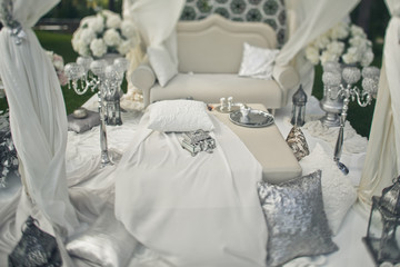 The luxury sofa with decorations in the park