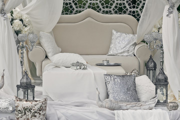 The luxury sofa with decorations in the park